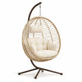 Sedia sospesa in rattan con cuscini in poliestere crema